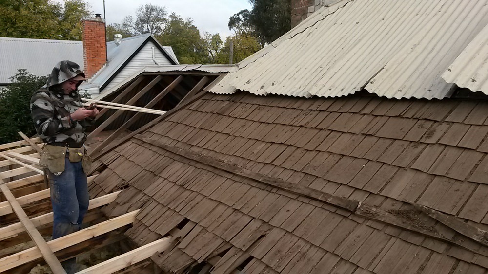  Discovering ye olde original timber shingles underneath already very old corrugated iron 